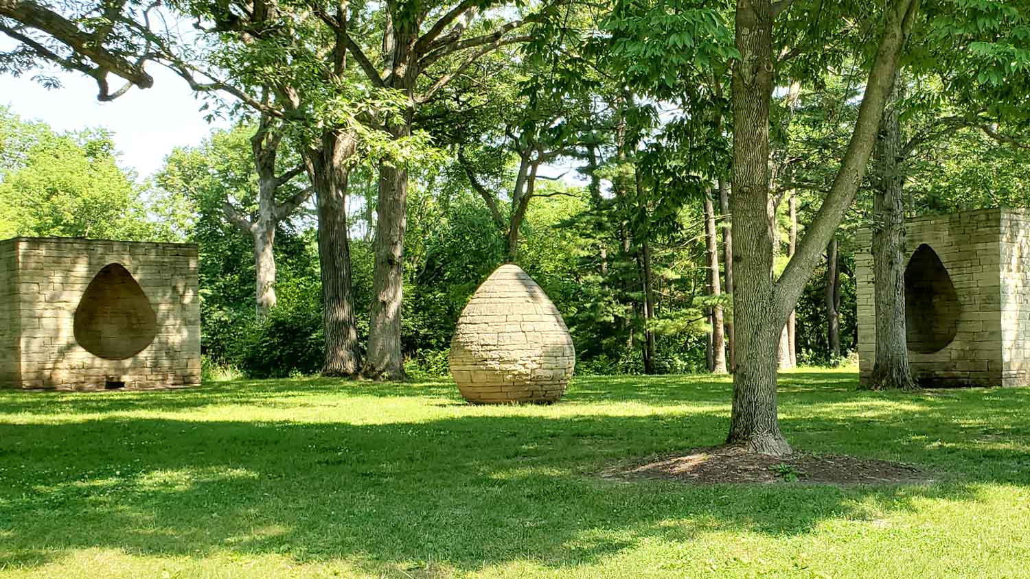 Three Cairns by Andy Goldsworthy, Iowa limestone, lead, and steel sculpture at Greenwood Park, Des Moines, Iowa.