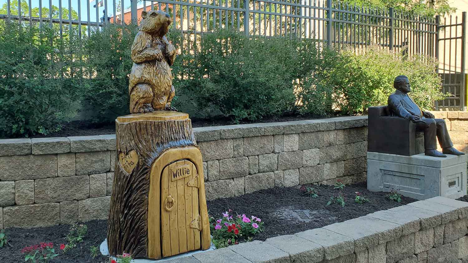 Woodstock Willie wood carving statue in the sculpture garden.