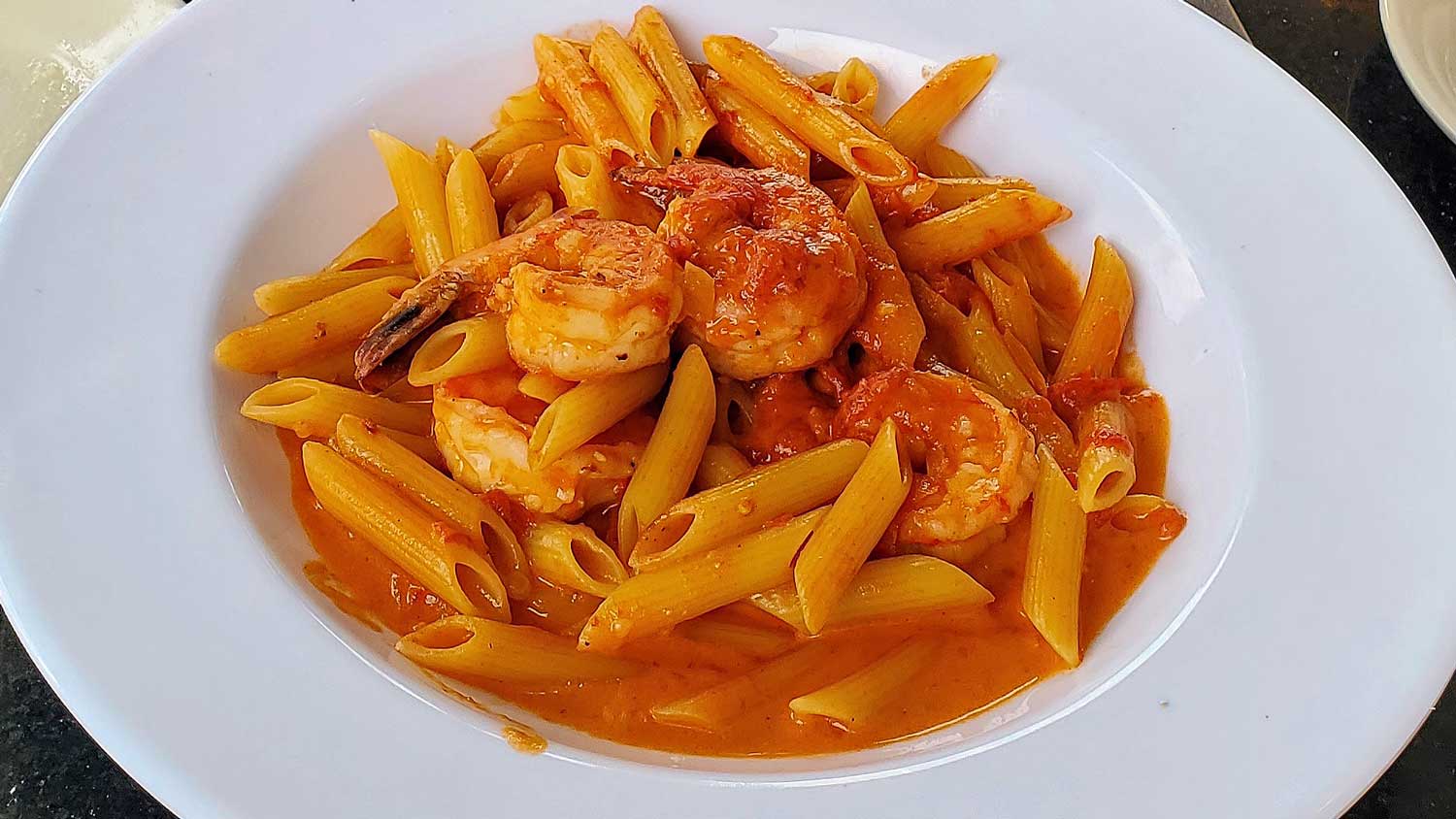 Penne with shrimp in red sauce.