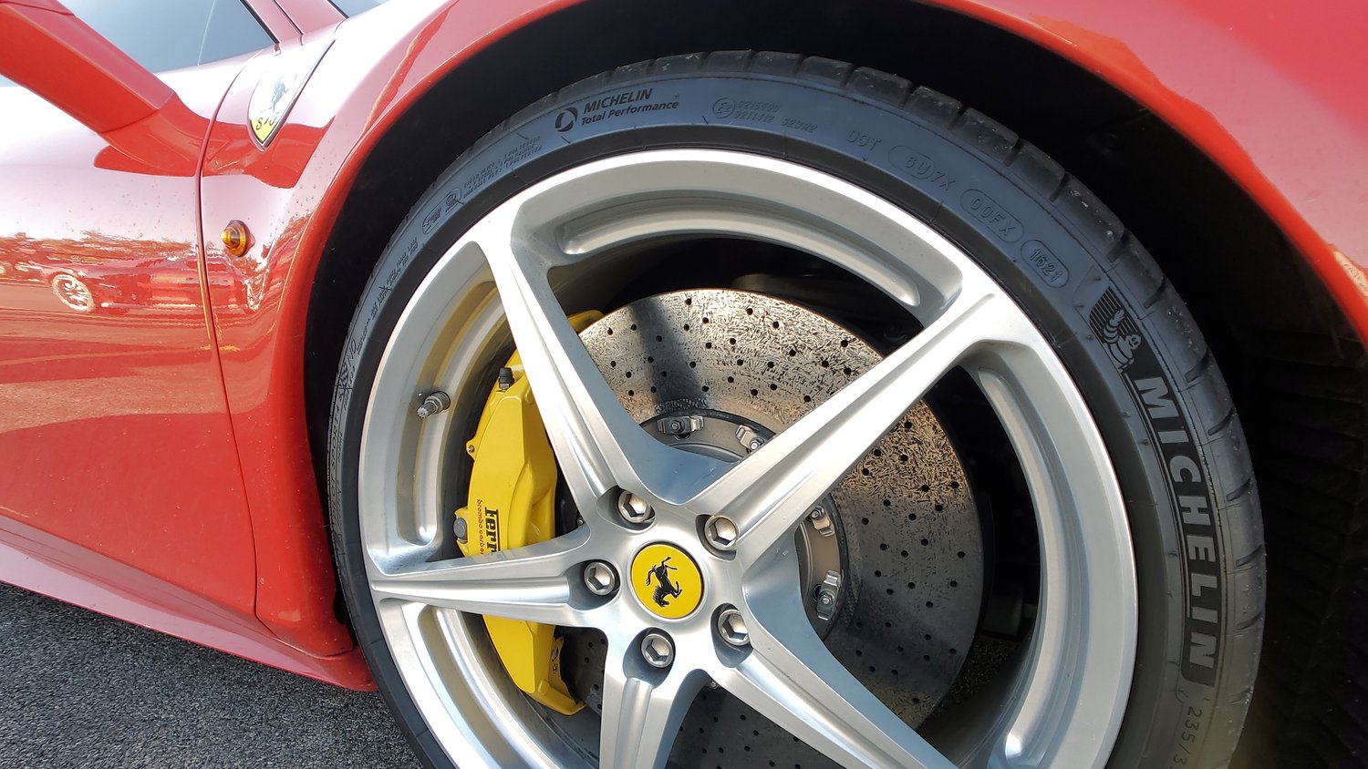 Ferrari brake caliper and vented rotor.