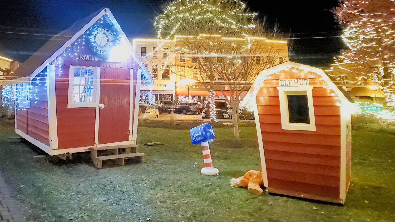 Santa house, elf hut, and sleeping gingerbread man at the Historic Square in Woodstock, IL.