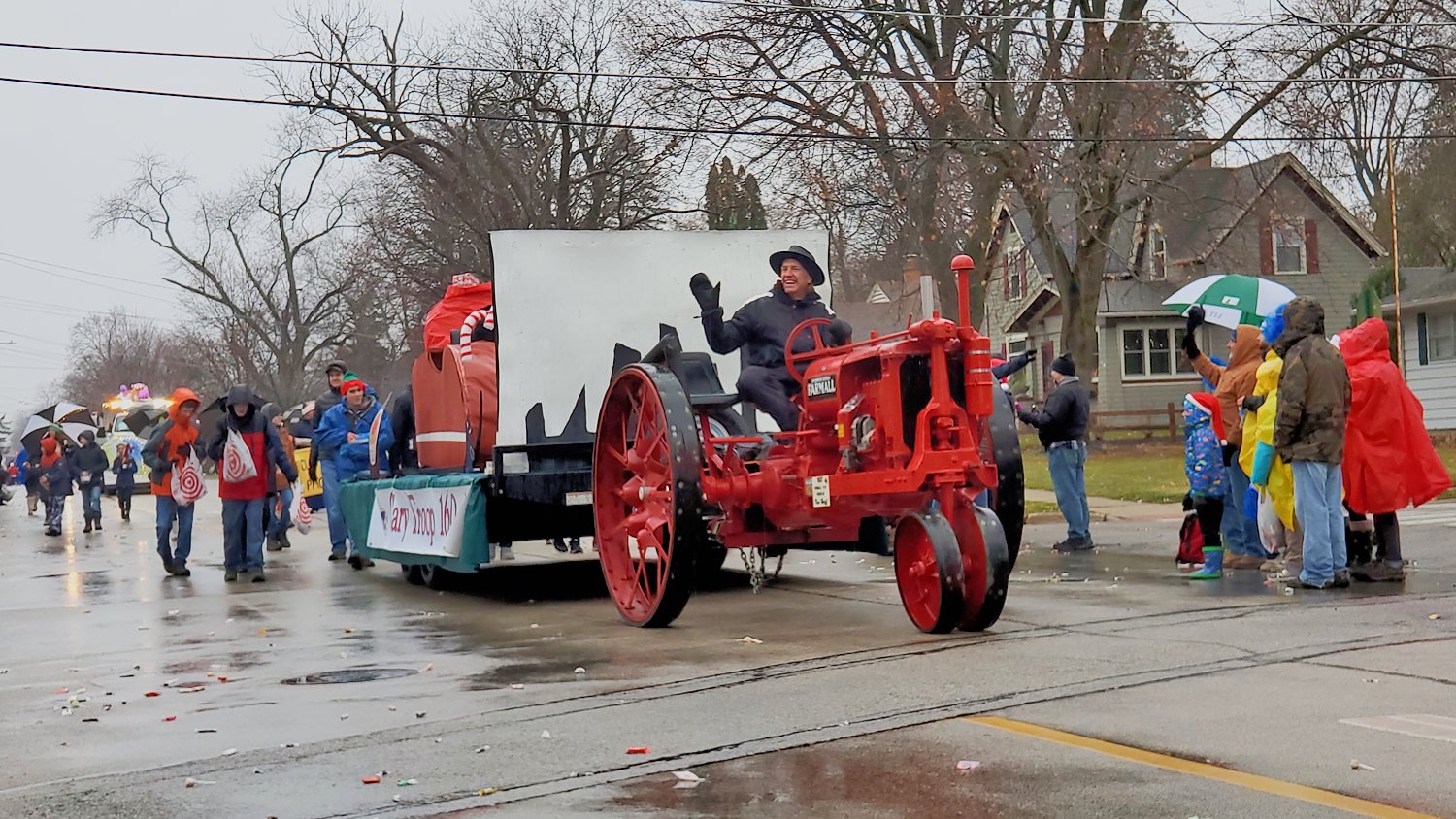 1937 vintage Farmall F-12 tractor pulling the Cary Troop 160 Boy Scouts float.