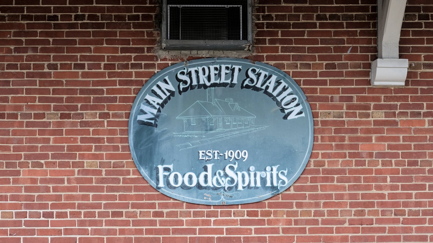 Main Street Station Food & Spirits, established 1909 signage.