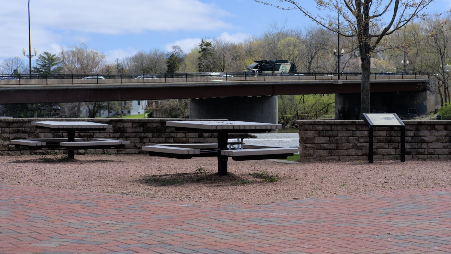 Built in picnic tables at Cornish Park between the playground and the Fox River.