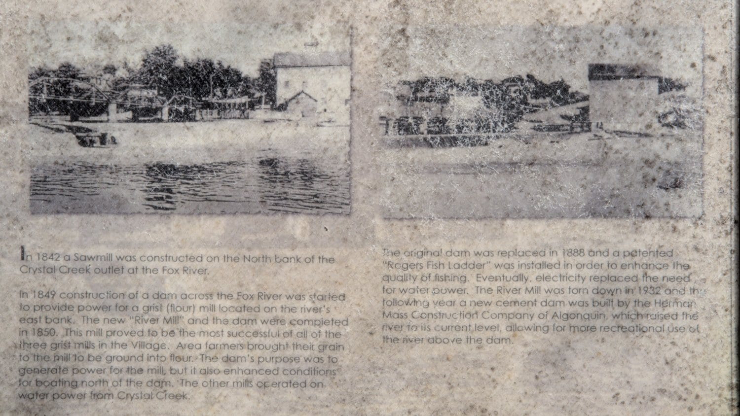Historical plaque detailing the installation of the dam and the River Mill.
