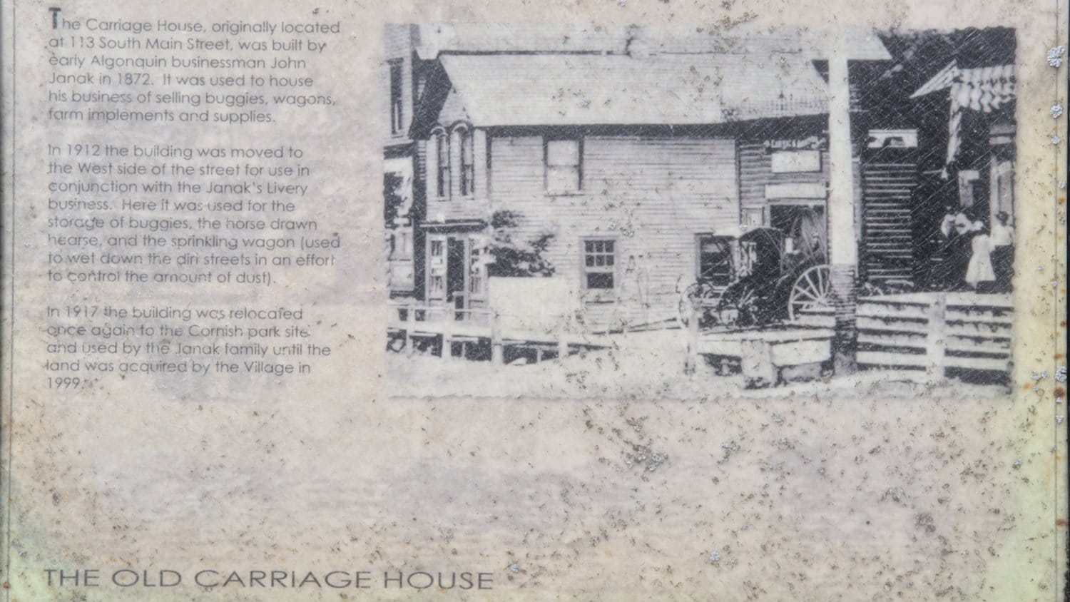 Historical plaque detailing J. Janak's Old Carriage House.