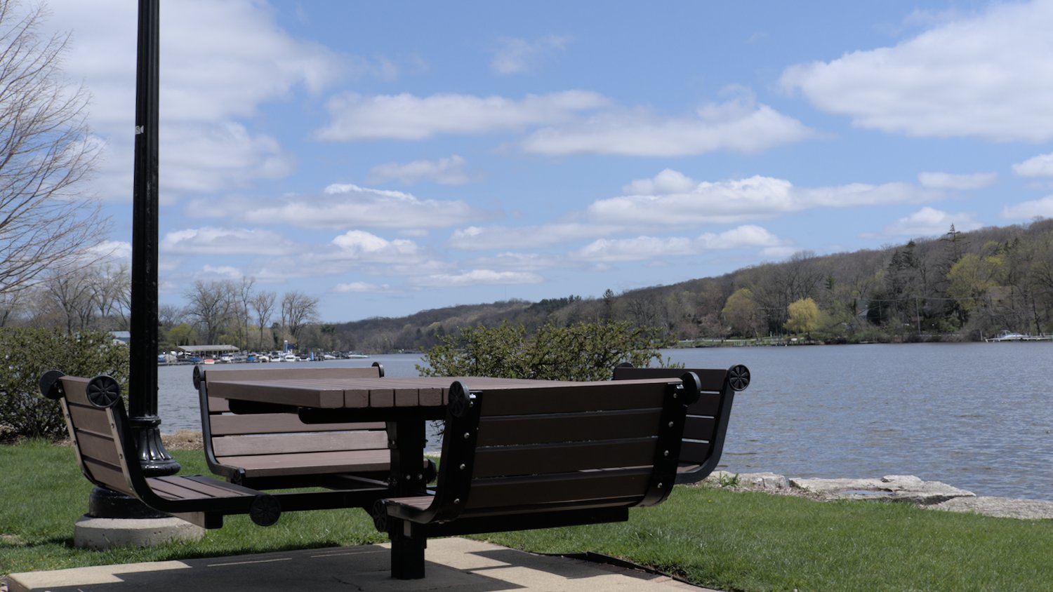 Built-in picnic tables and chairs along the river.