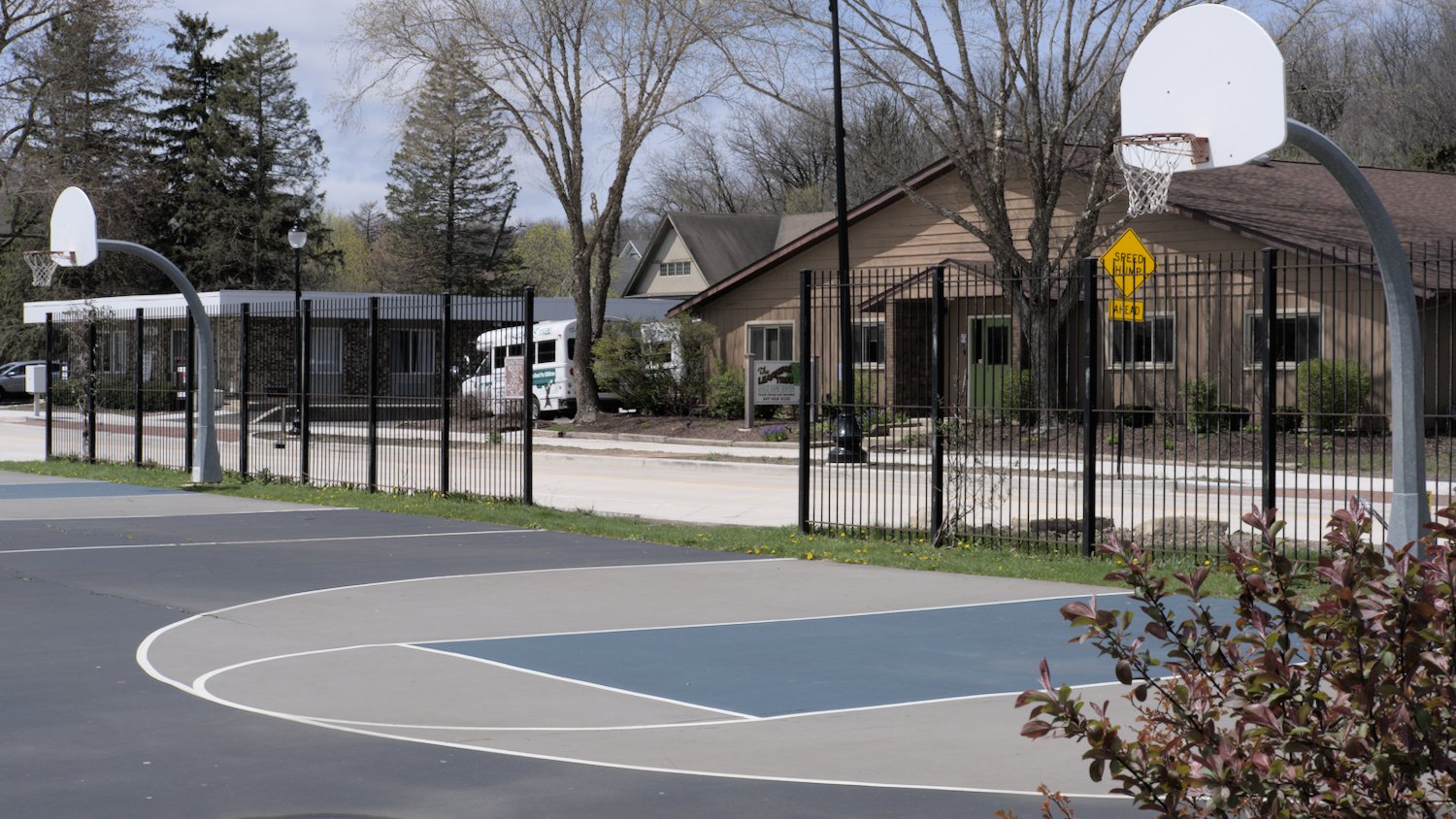Two basketball courts in the park.