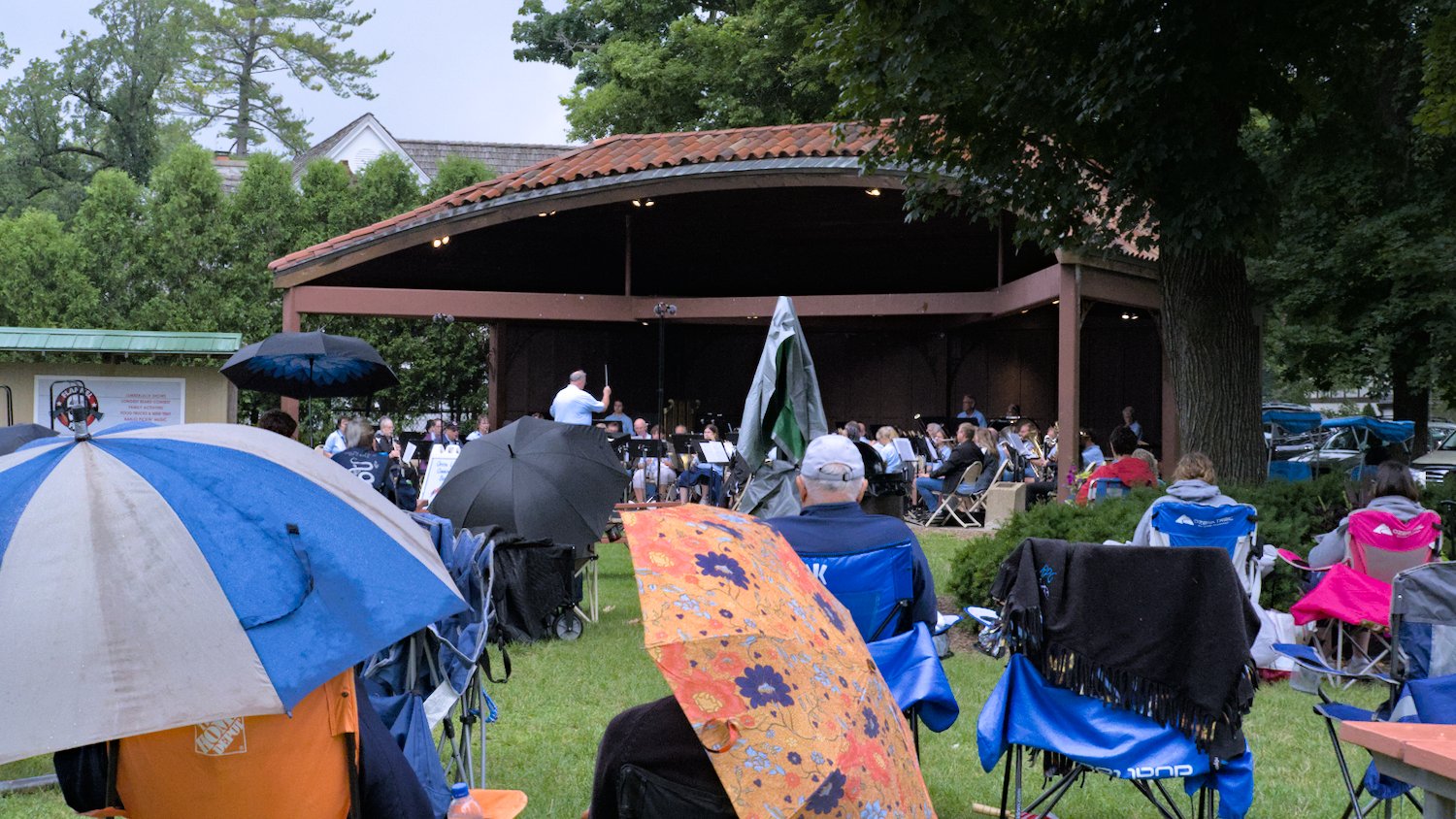 Umbrellas shielding the audience.
