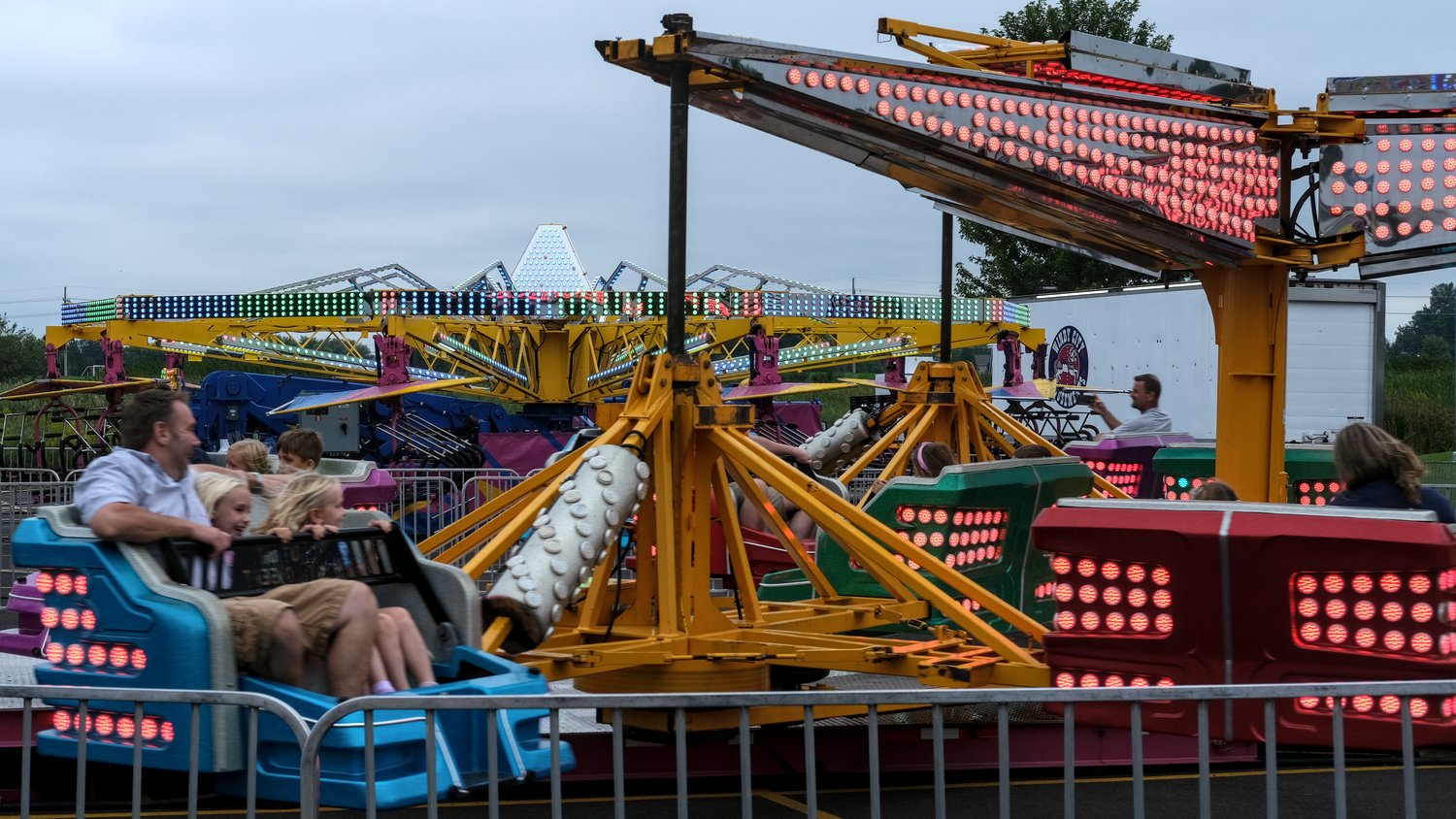Riders on the Sizzler ride.