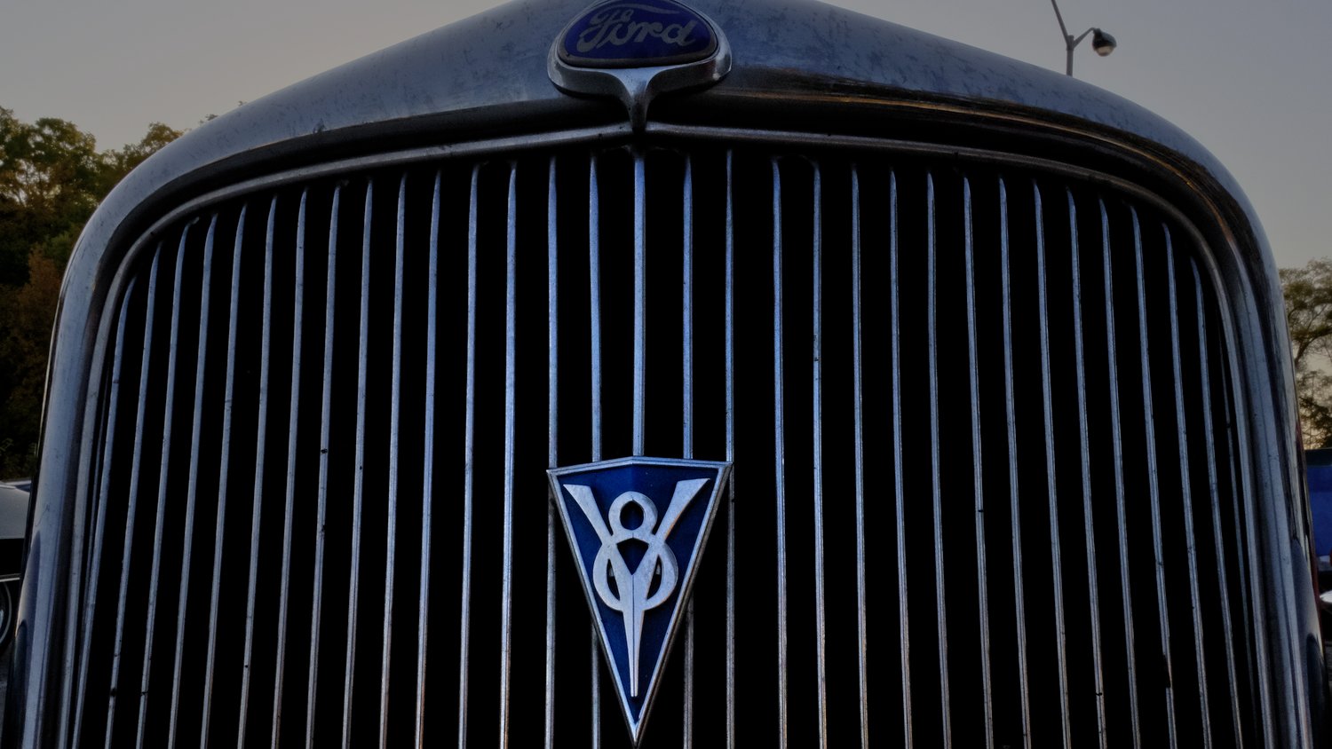 Grille and emblem of Ford V8.