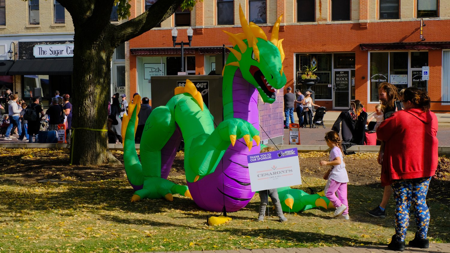 Kids with giant inflatable dragon.