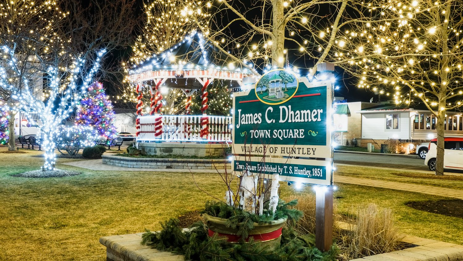 James C. Dhamer Town Square sign at the Huntley Town Square.