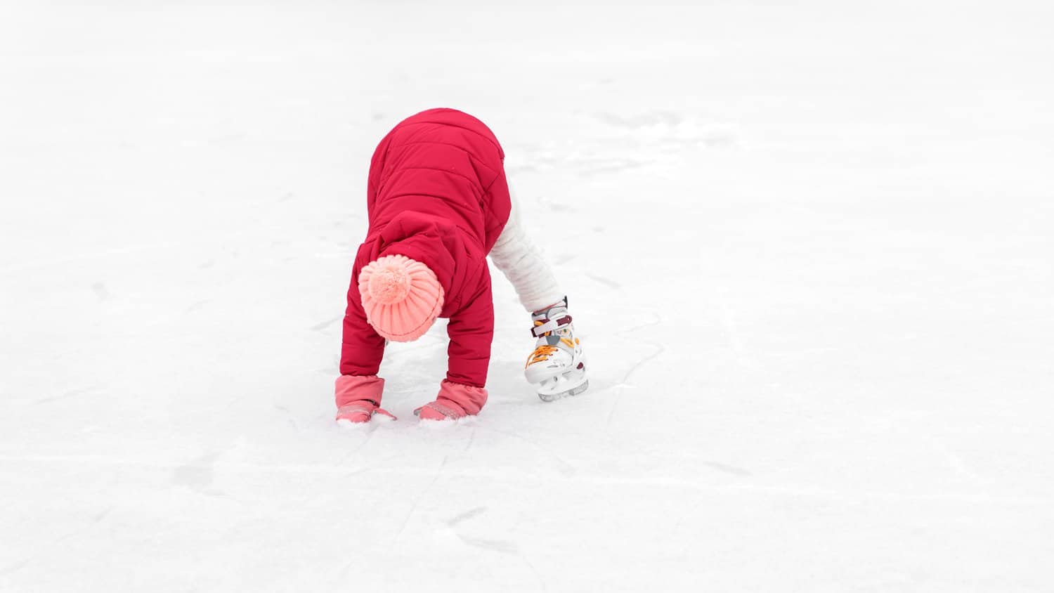 Little girl on ice skates.