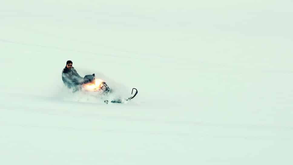 Man on a snowmobile.