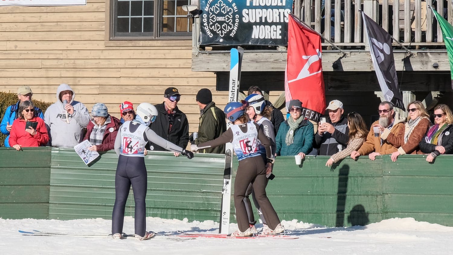 Eva Minotto, Ella Wilson, and Emma Russell, all of Steamboat Springs Winter Sports Club, congratulating each other at the 118th annual Norge Ski Club, winter tournament, 2023.