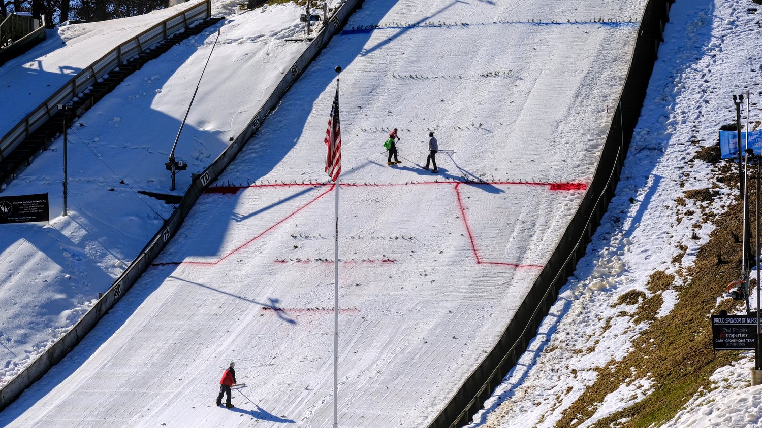 Workers preparing the hill for the 118th Annual Norge Ski Club Winter Tournament.
