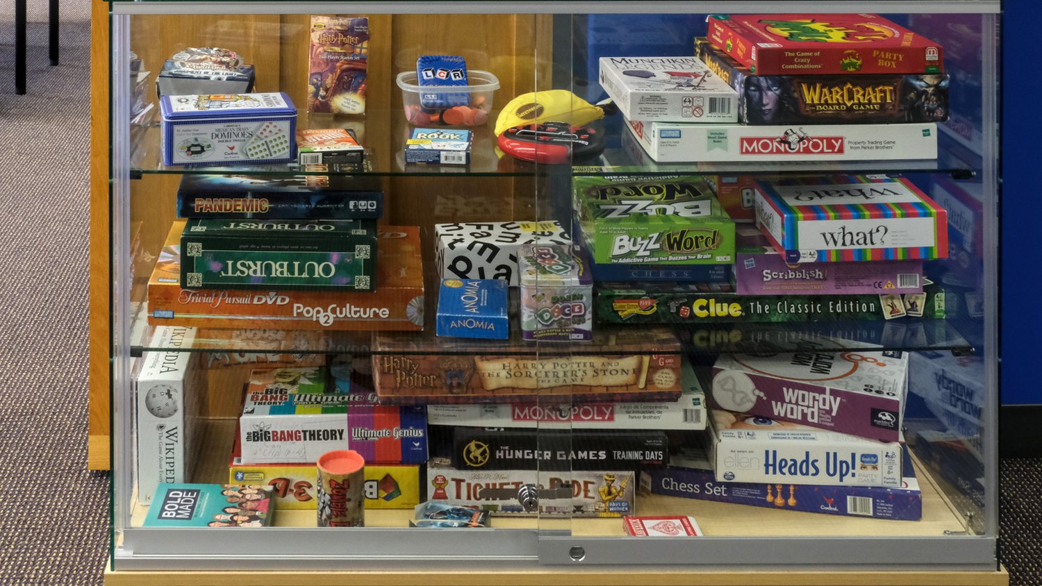 Display cabinet filled with games.