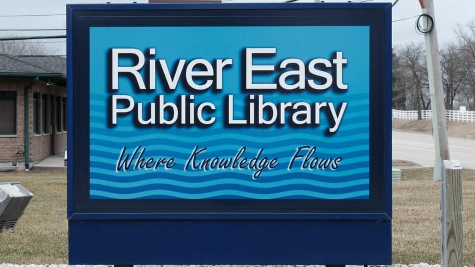 River East Public Library. Where knowledge flows sign.