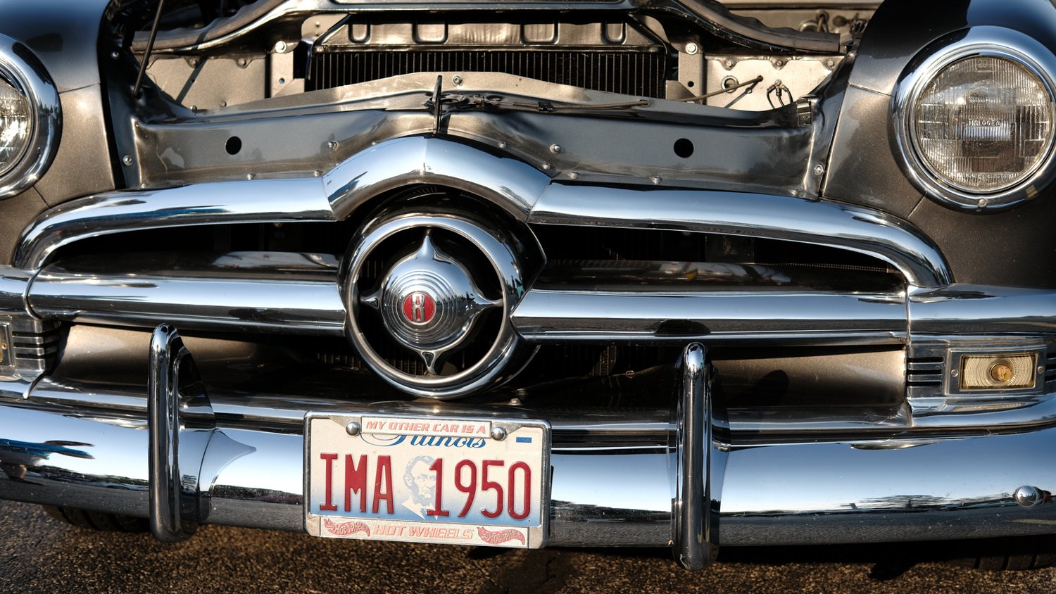 Shiny chrome bumper of the 1950 Ford Custom Deluxe.