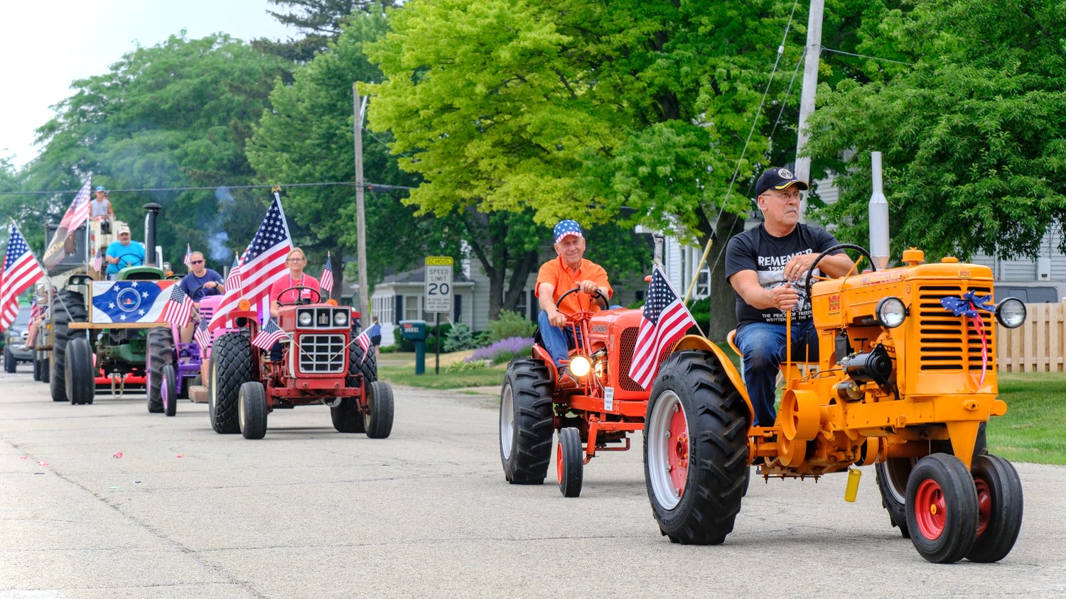 Tractors driving in the parade.