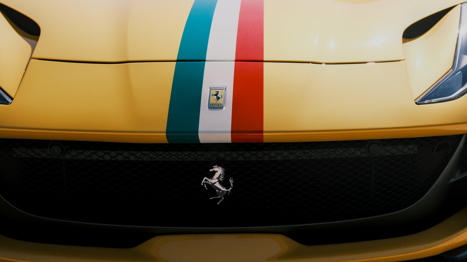 Front of a yellow Ferrari.