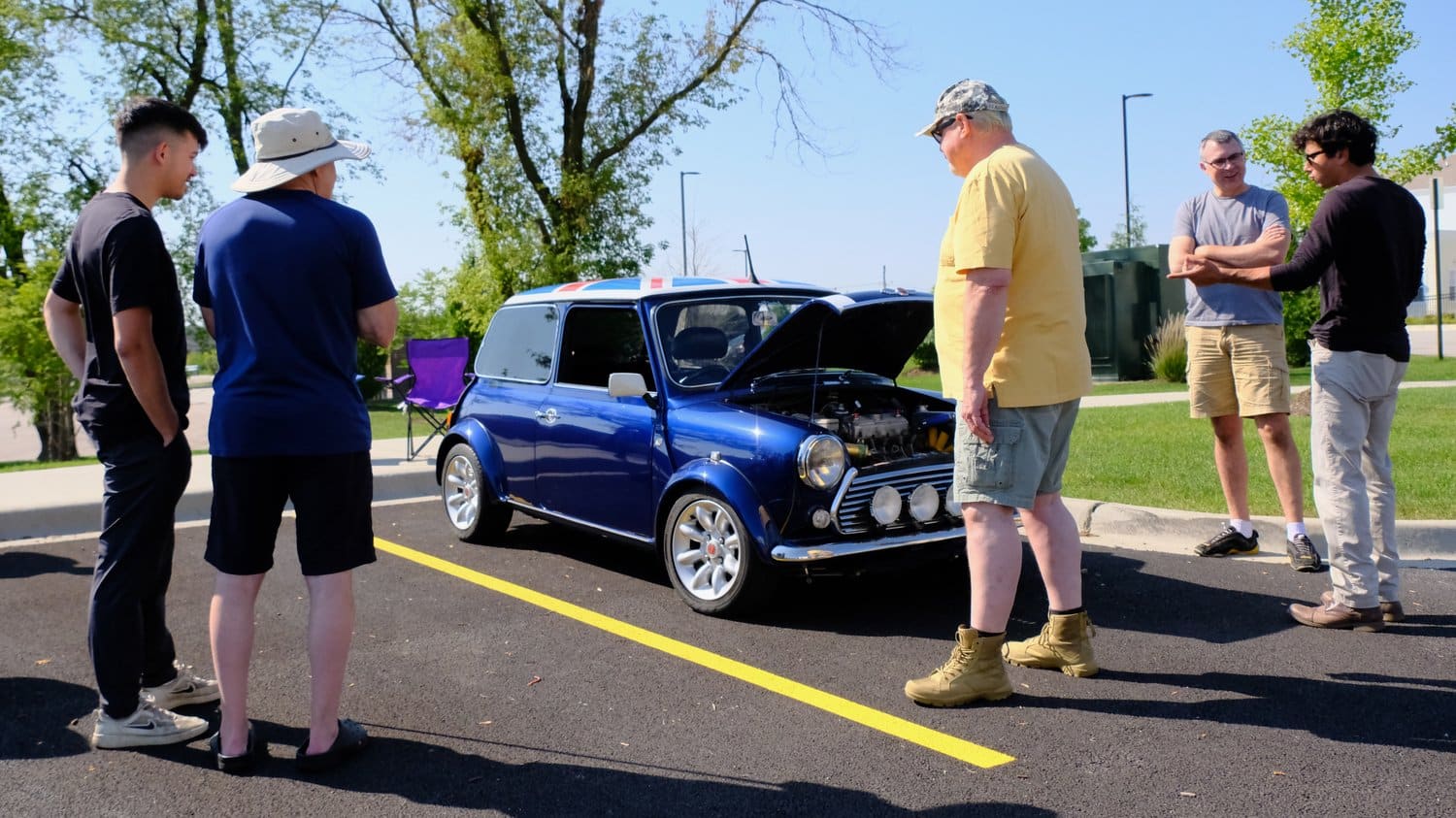 Car enthusiasts checking out the Mini Cooper.