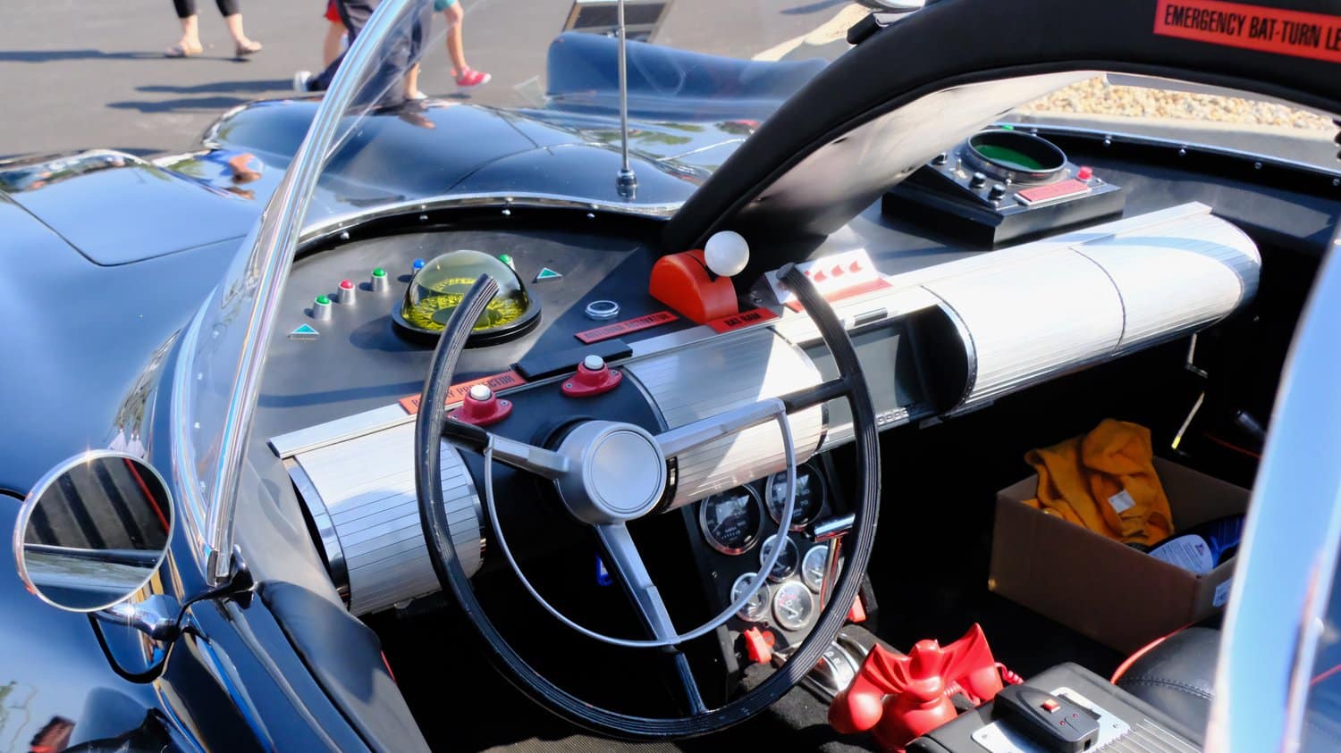 Interior buttons and controls of a replica, vintage Batmobile.