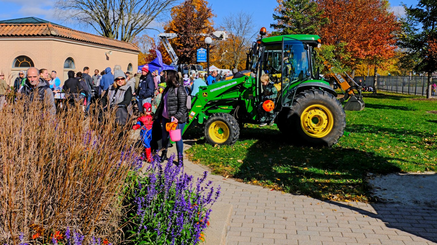 Trick or treater checking out one of the tractors.