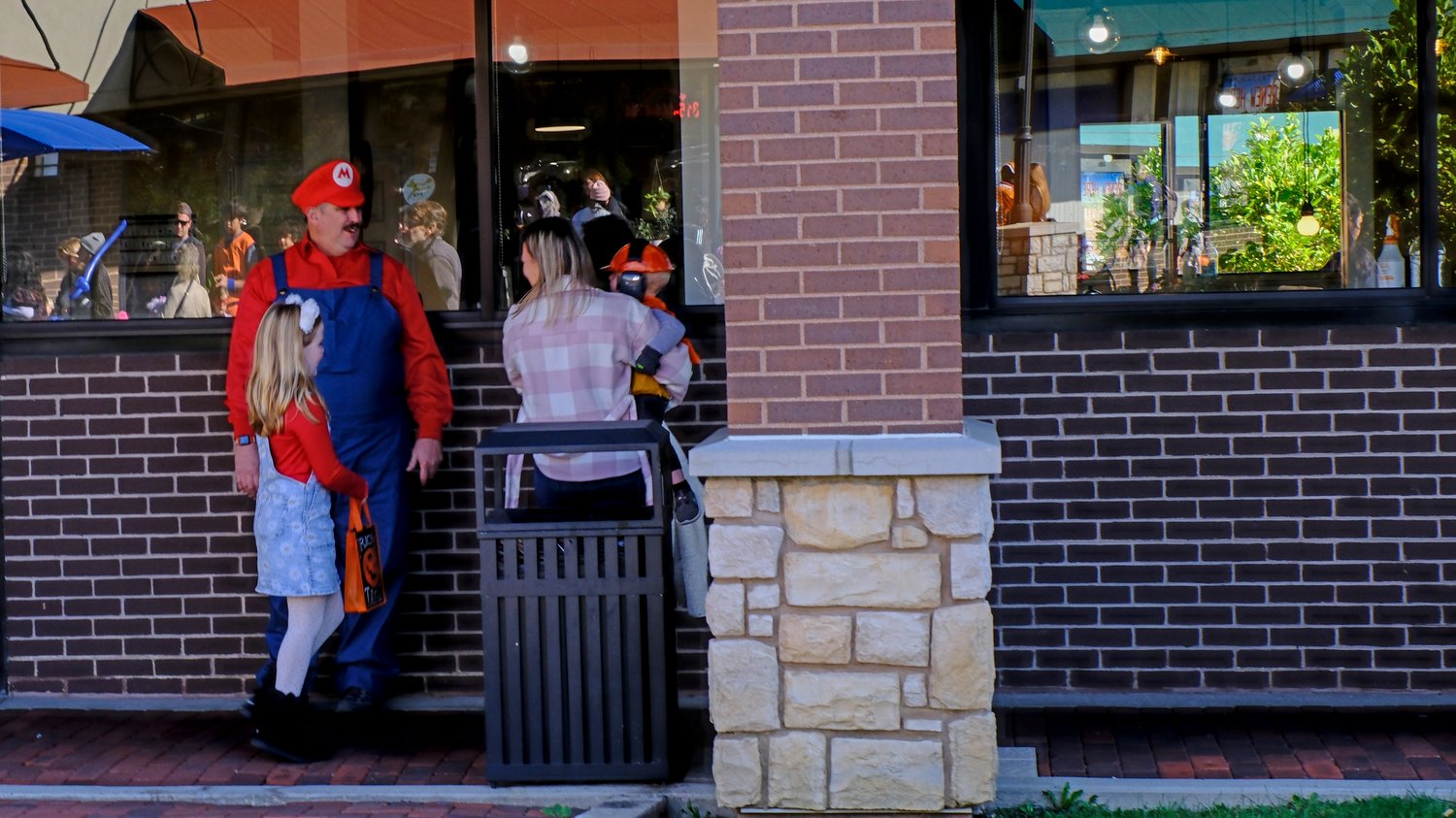 Trick-or-treaters chatting with Star 105.5's Joe "Mario" Cicero.