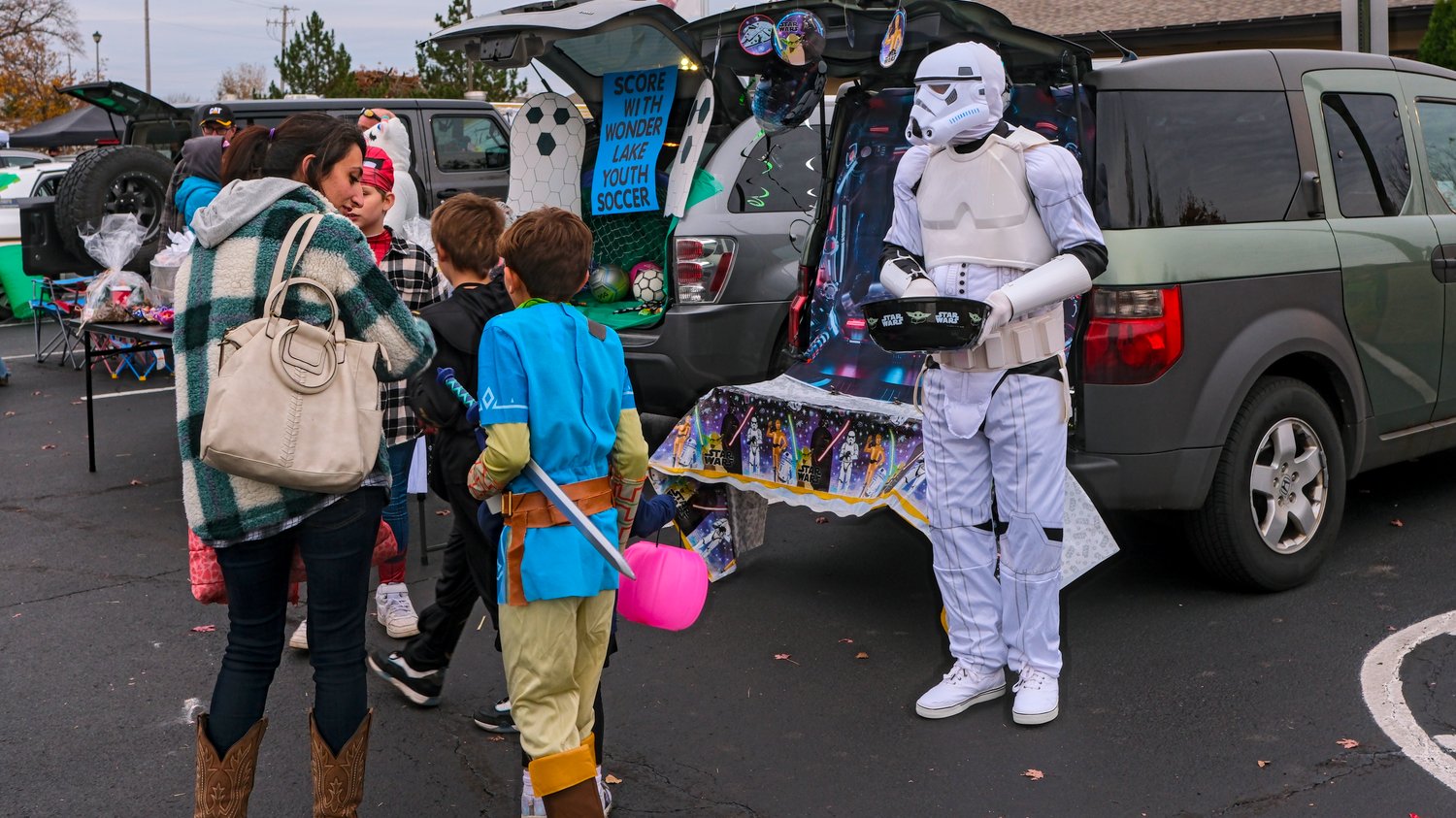Stormtrooper handing out candy.