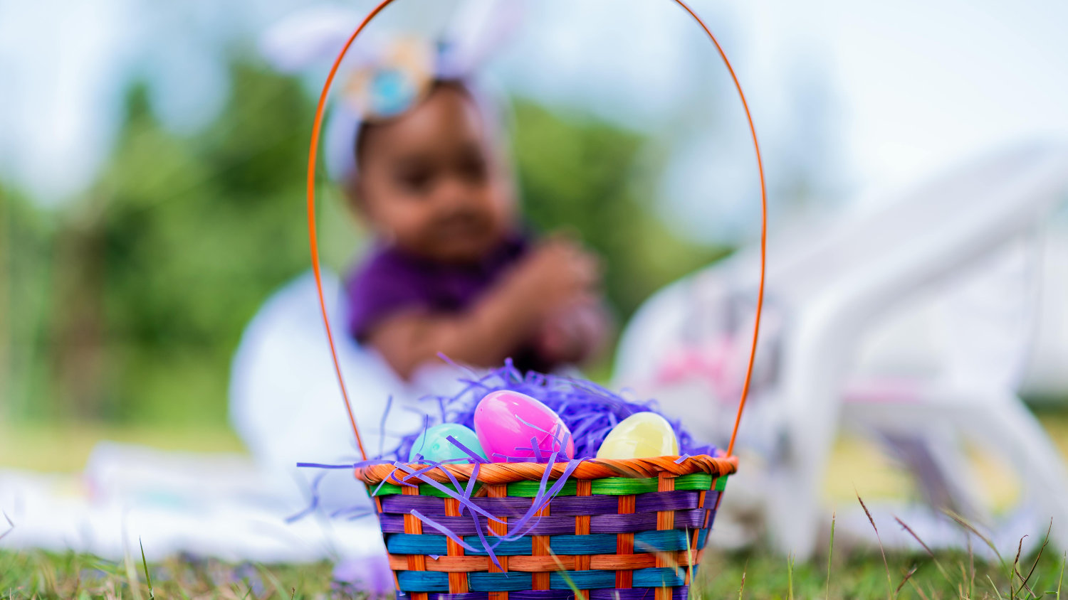 Easter basket with little girl in the background.