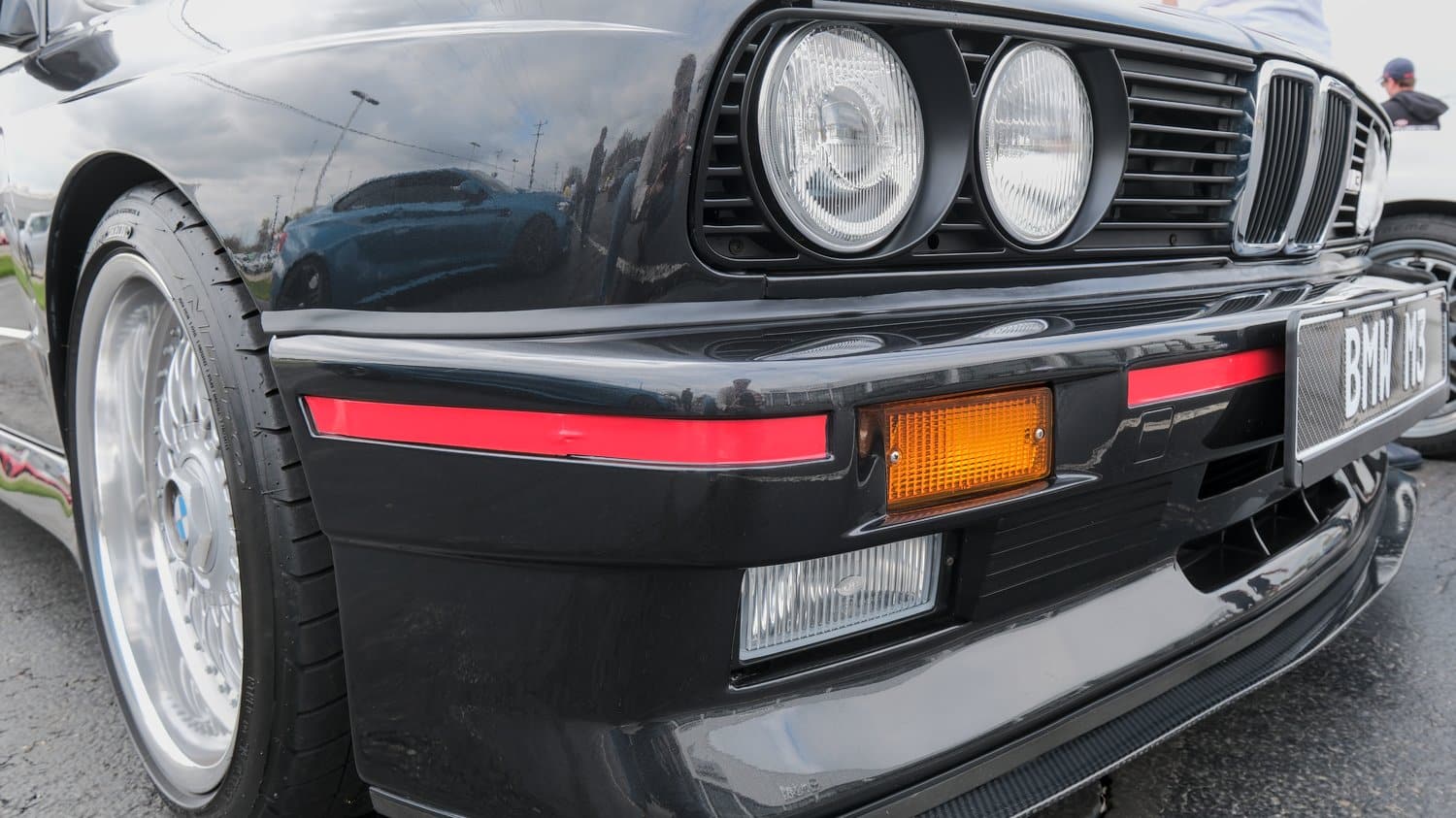 Round headlights on an older BMW M3.