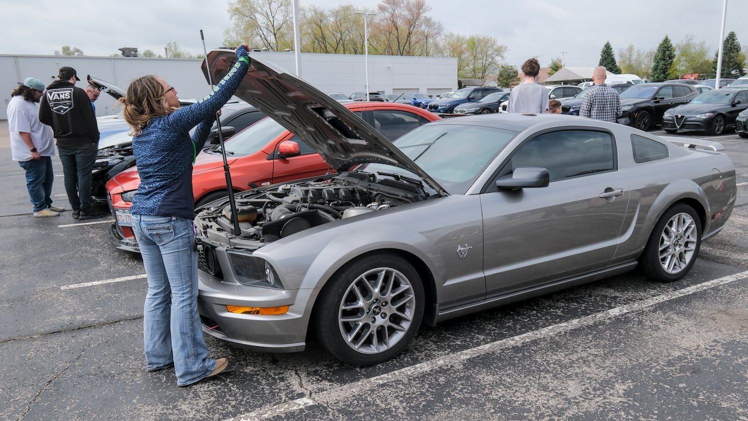Propping the hood on the Mustang.